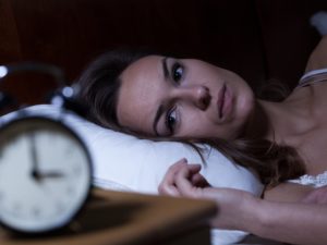 Insomniac woman awake at night